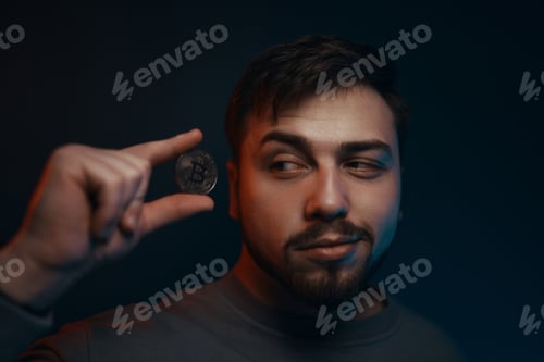 Preview: Man holding bitcoin. Financial ecosystem. The currency of the future.