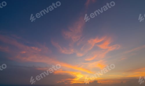Preview: Sunset sky. Abstract nature background. Dramatic blue and orange, colorful clouds at twilight time.
