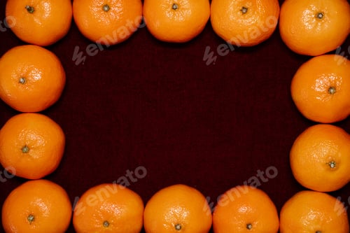 Preview: Ripe Clementine frame on red Background