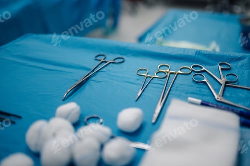 Preview: Surgical Tools and Supplies on Sterile Blue Surface