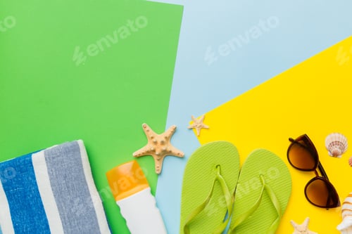 Preview: Beach accessories straw hat and seashell on colored table. Summer concept background