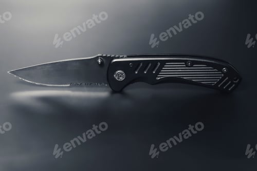 Preview: Every day carry pocket folding knife on black background.