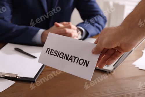 Preview: Employee giving resignation letter to boss in office, closeup