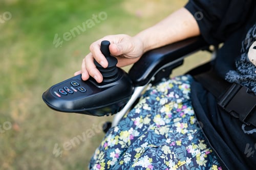 Preview: Asian lady woman patient on electric wheelchair with joystick and remote control