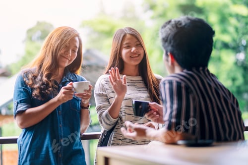 Preview: A woman greeting and say hi to her male friends while drinking coffee