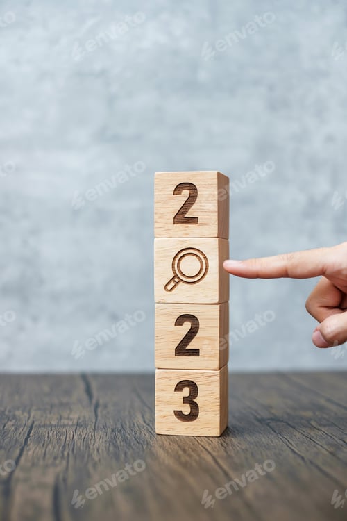 Preview: 2023 block with magnifying glass icon.