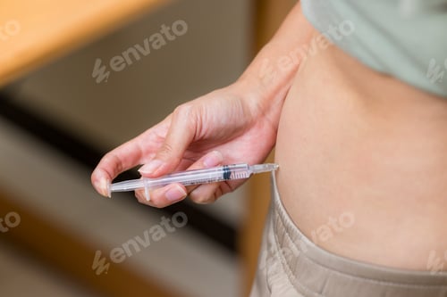 Preview: Woman injects hormones into the belly with a syringe