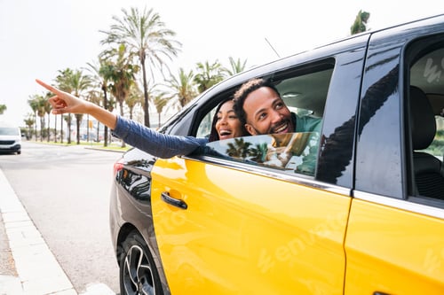 Preview: Happy hispanic latino couple taking a taxi