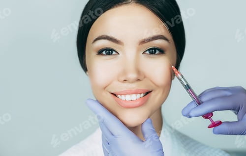 Preview: Beautiful Asian woman gets beauty injections. Close-up injection of anti-aging and wrinkle perfect