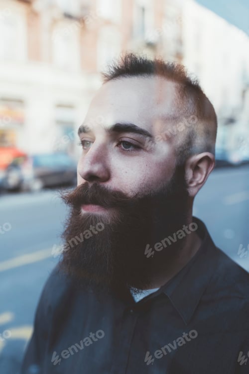 Preview: Portrait of bearded man looking away