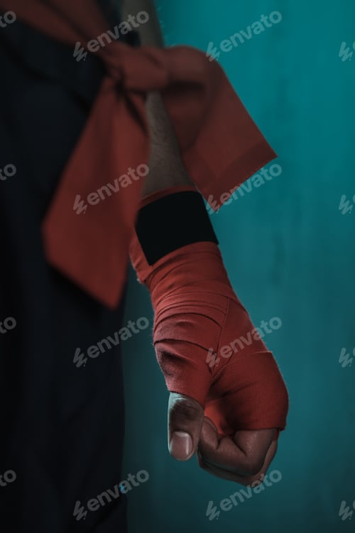Preview: Muay Thai athlete training at Thai boxing indoors, ultimate fight concept