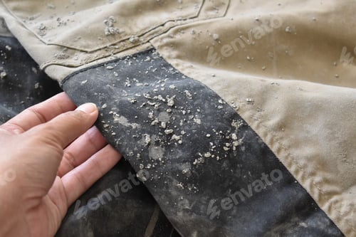 Preview: Dirty clothes with cement stains.