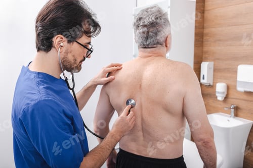 Doctor Examines Senior Man with Stethoscope
