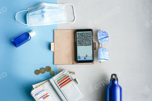 Preview: Travel items flat lay on blue and grey background