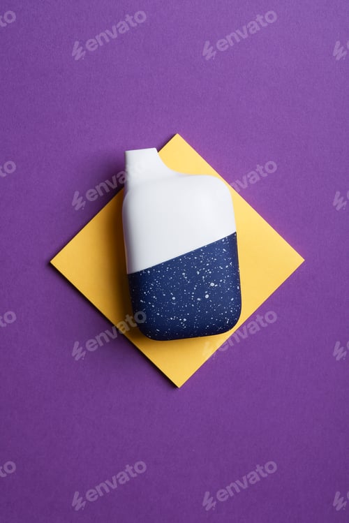Preview: disposable electronic cigarette or vape on purple background. top view copy space.