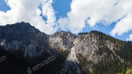 Preview: Scenic shot of a mountainous landscape with trees in the foreground in Sichuan Province, China