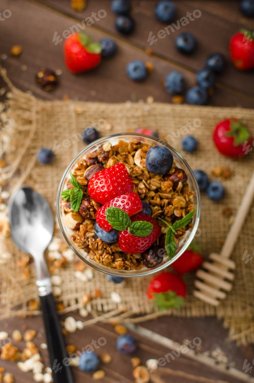 Preview: Yogurt with baked granola and berries in small glass