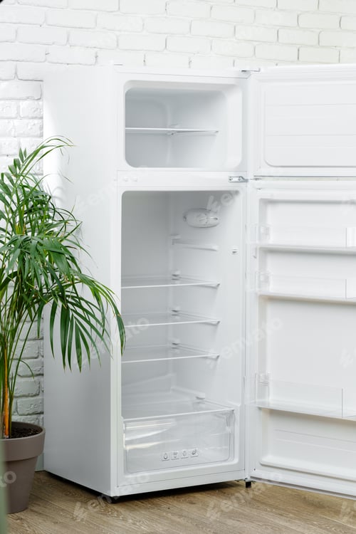 Preview: White Refrigerator Open Against Brick Wall