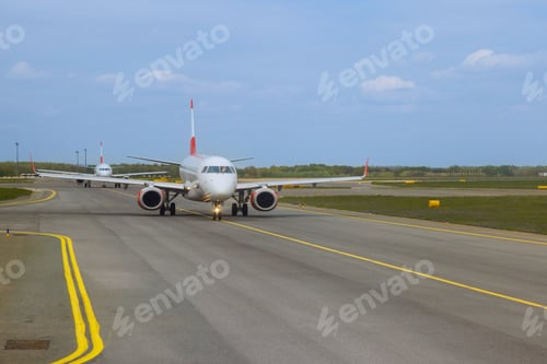 Preview: Plane is currently positioned on the runway, undergoing preparations taking off.