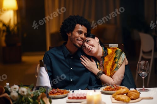Preview: Affectionate couple by served table