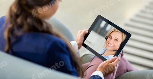 Preview: Woman having video call on digital tablet