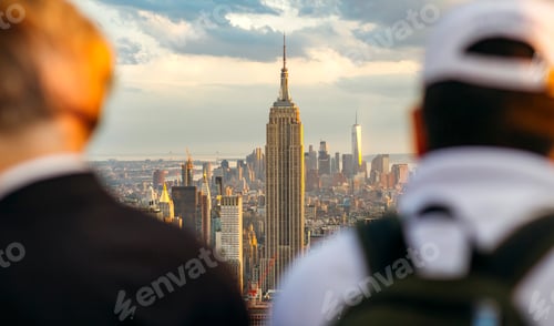 Preview: The Empire State Building in Manhattan between two unrecognizable men in foreground
