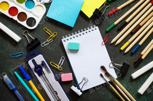 Preview: Back to school background with school supplies, apple on dark concrete or stone background.