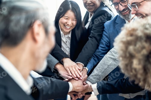Preview: Multiracial business people stacking hands together in modern office - Teamwork concept