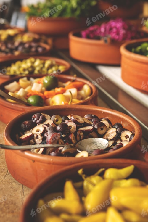 Preview: Delicious buffet table with Fresh and Vibrant Organic Vegetables in Rustic Clay Bowls