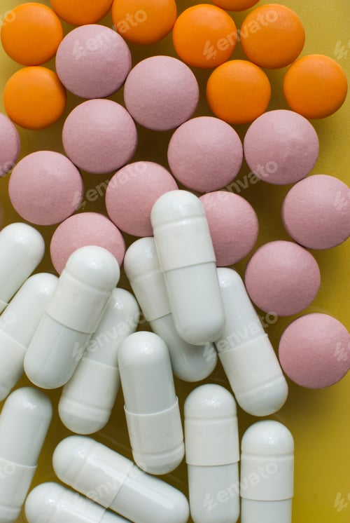 Preview: White, pink and orange pills