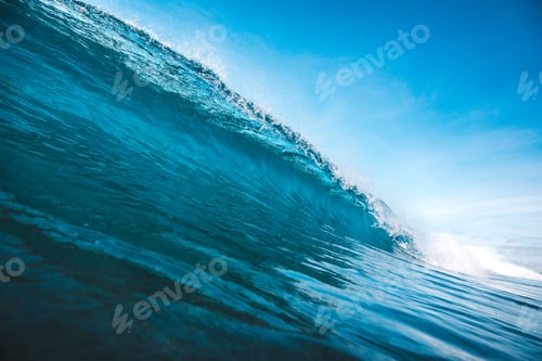 Preview: Beautiful shot of a wave taking shape under the clear blue sky captured in Lombok, Indonesia