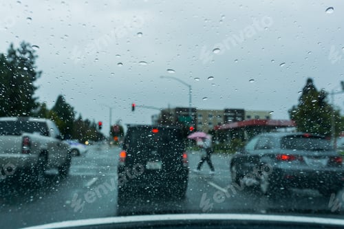 Preview: Raindrops on the windshield while driving on a rainy day