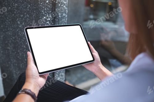Preview: Mockup image of a woman holding digital tablet with blank white desktop screen