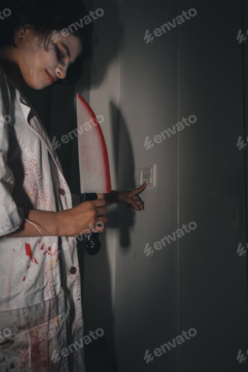Preview: Trick or treat zombie teenage girl with bloody knife knocking on door on Halloween