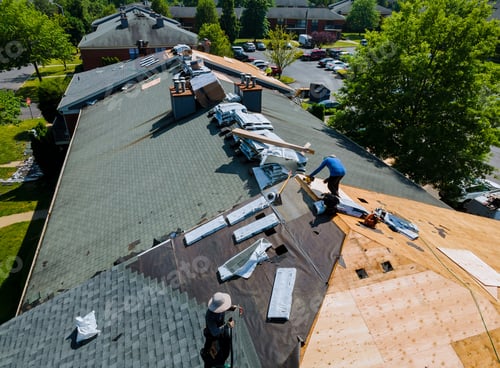Preview: Construction worker on a renovation roof the house installed new shingles