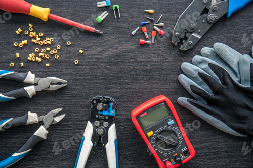 Preview: Different electrical tools on wooden background, flat lay.