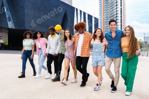 Preview: Happy playful multiethnic group of young friends bonding outdoors