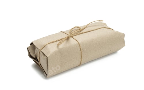 Preview: Paper roll packaging tied with brown rope and isolated on white background