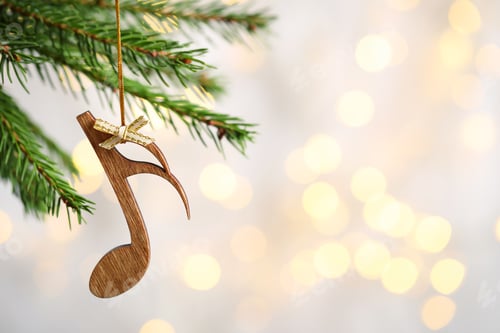 Preview: Fir tree branch with wooden note against blurred lights, space for text. Christmas music