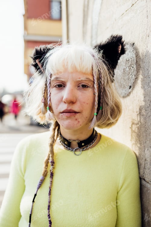 Preview: Gender fluid contemplative real beauty young woman outdoor looking camera