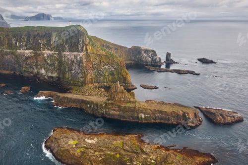 Preview: Faroe islands dramatic coastline viewed from helicopter. Mykines cliffs