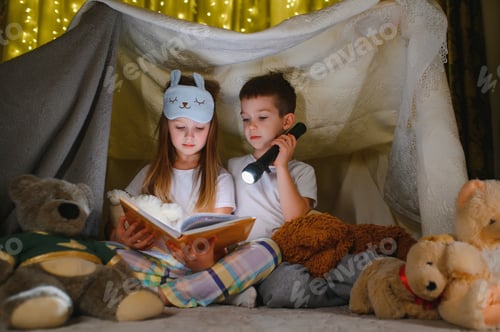 Preview: Children Reading in Cozy Blanket Fort with Flashlight