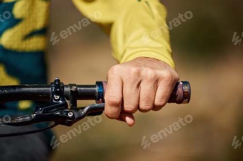 Preview: Hand, handle and bike with a man athlete or cyclist riding outdoor for fitness, exercise or cardio.