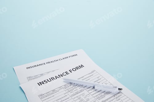 Preview: close-up view of insurance form, insurance health claim form and pen isolated on blue