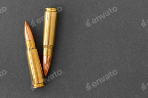 Preview: Two bullets on gray background. Cartridges 7.62 caliber for Kalashnikov assault rifle