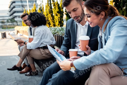 Preview: Group of coworkers having a coffee brake together.