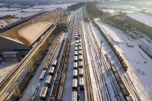 Preview: Aerial view of cargo train loaded with crushed stone materials at mining factory.