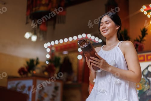 Preview: Young woman engaging in traditional fortune telling ritual