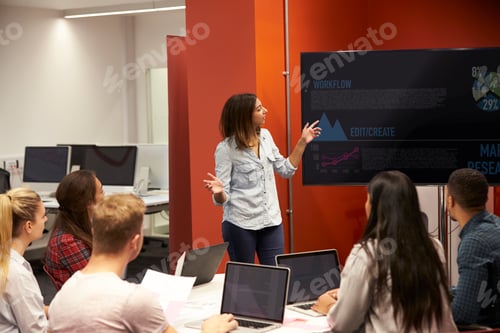 Preview: Teacher Talking To Students In College Class