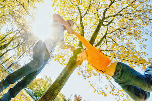 Preview: Father and son having fun in a beautiful autumn day